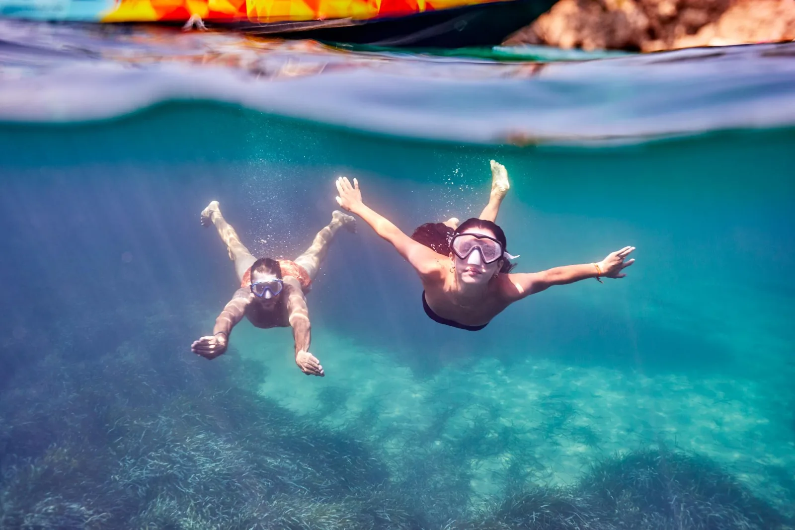 Snorkellers floating above the seabed at the trip's swim stop